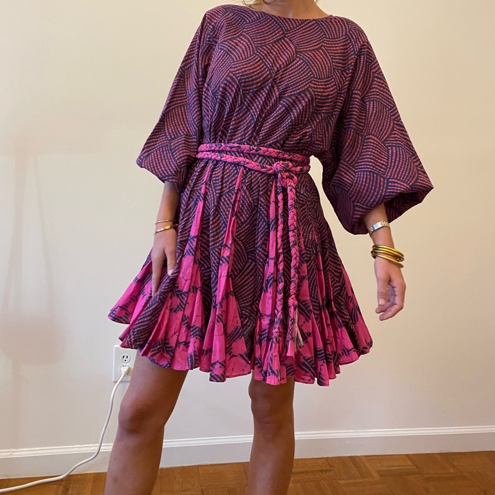 Cotton.optional hand-braided belt at waist.Long sleeves and elasticated cuffs.